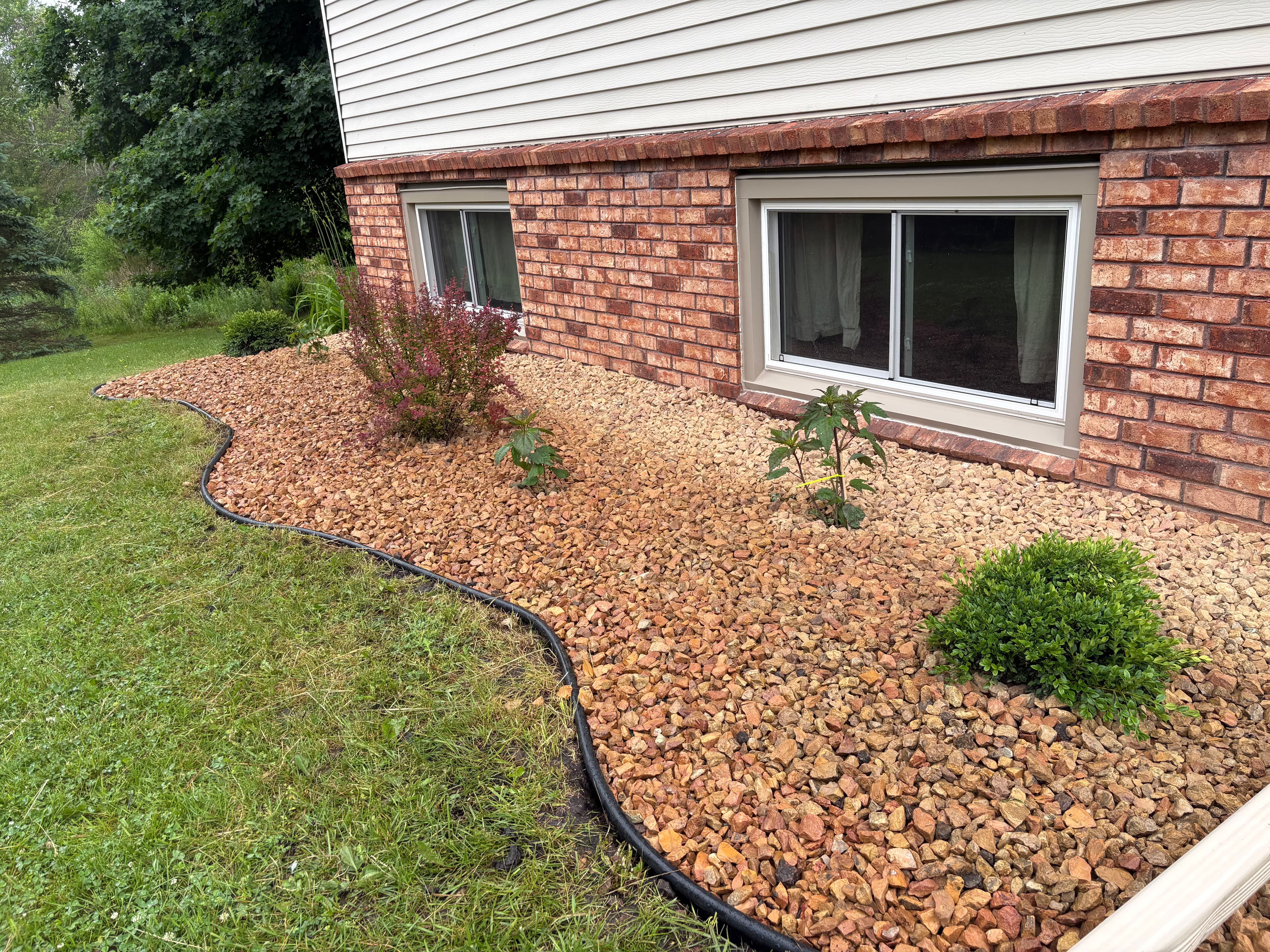 Project Overgrown Beds Cleared and Refreshed with Rock and New Plants image